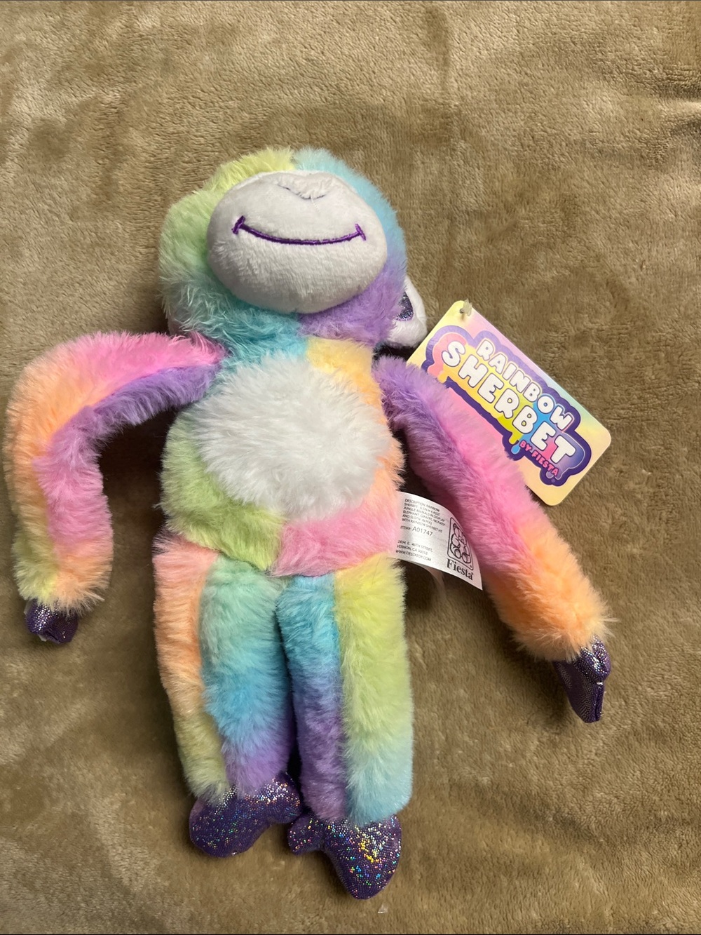 Fiesta Rainbow Sherbet Plush monkey in Pastel Multicolor